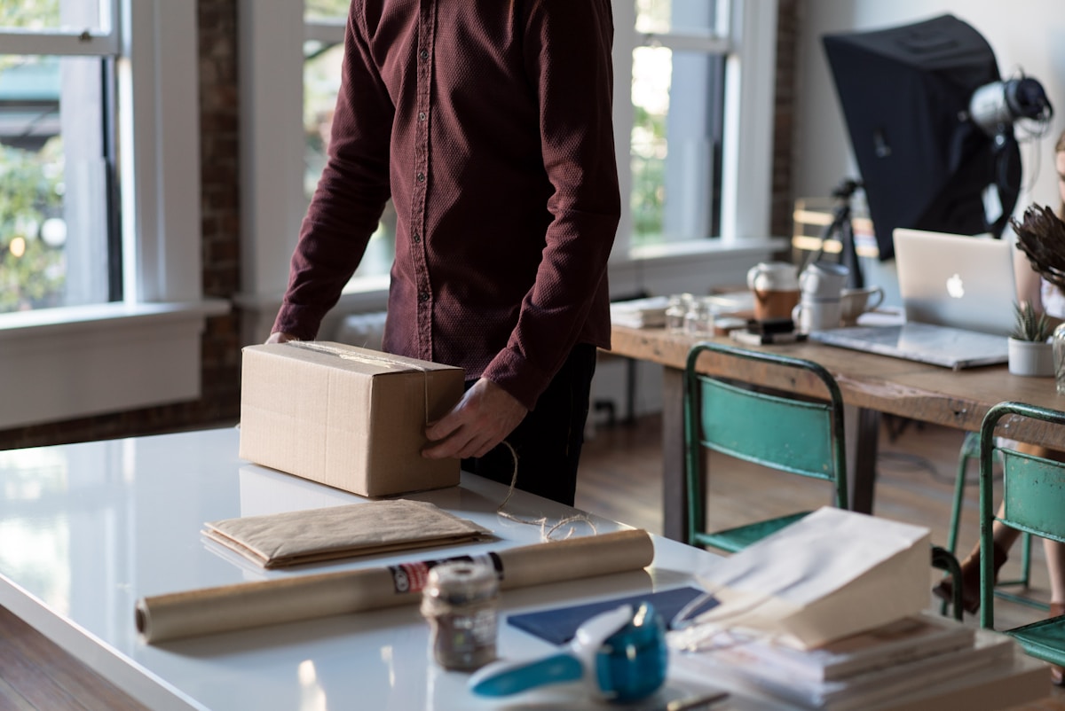 Small business team packing an online customer order